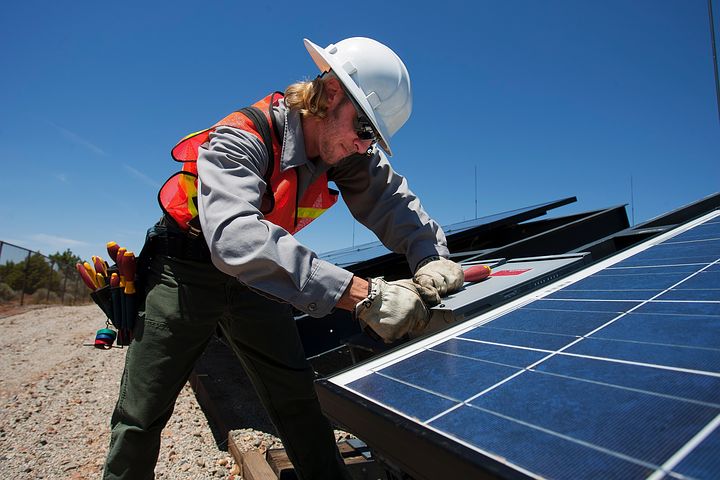 Worker installing commercial solar